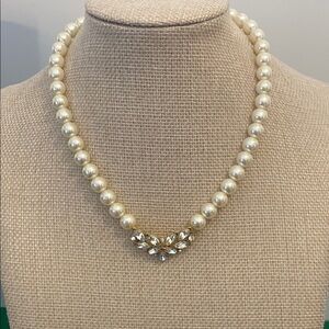 Faux pearl and rhinestone necklace.